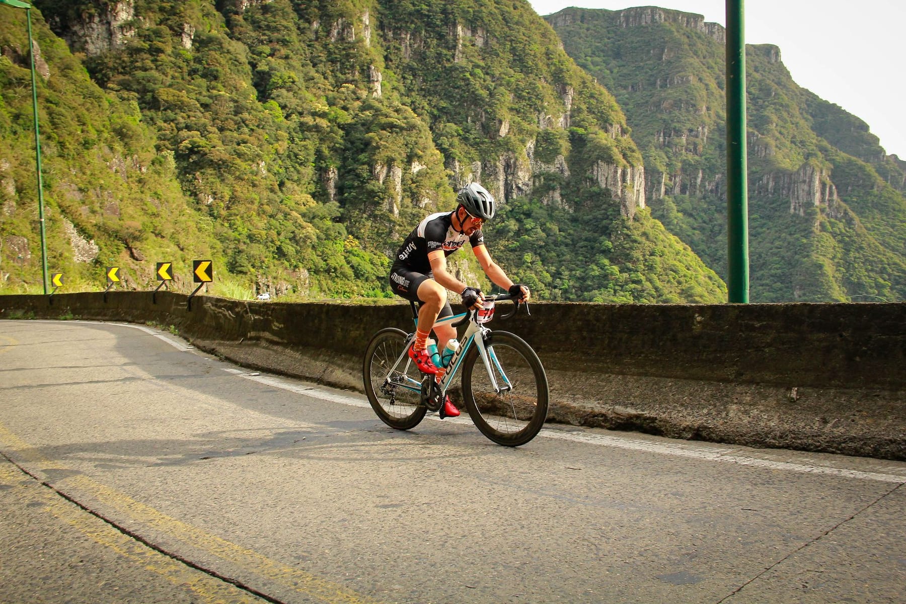 Road cyclist riding a Beyond bike on a mountain road